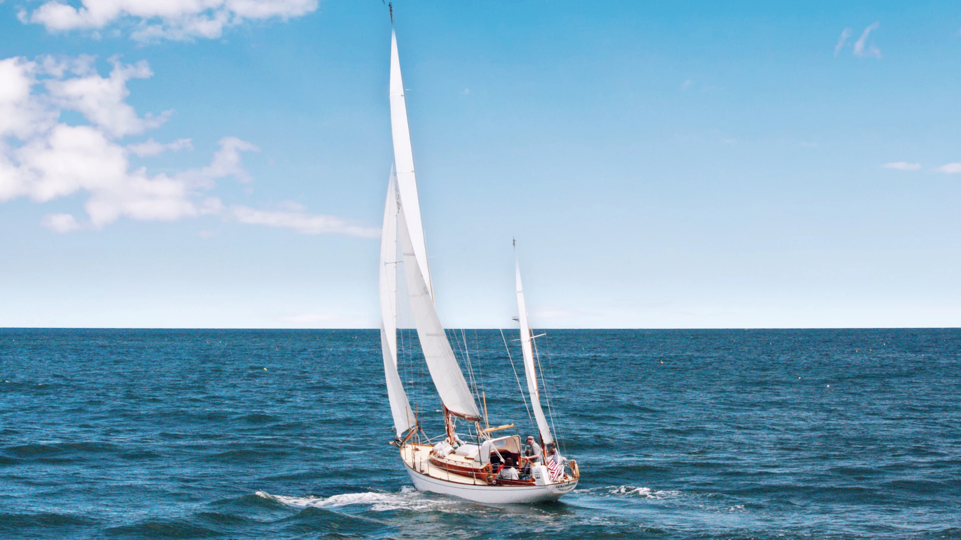 A sailing yacht in the clear blue waters of the British Virgin Islands